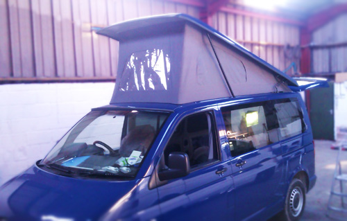 Blue VW Transporter fitted with Vanmax Poptop